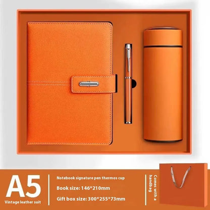 A5 notebook with imitation leather cover in a choice of colours including black, red, green, blue, and orange.