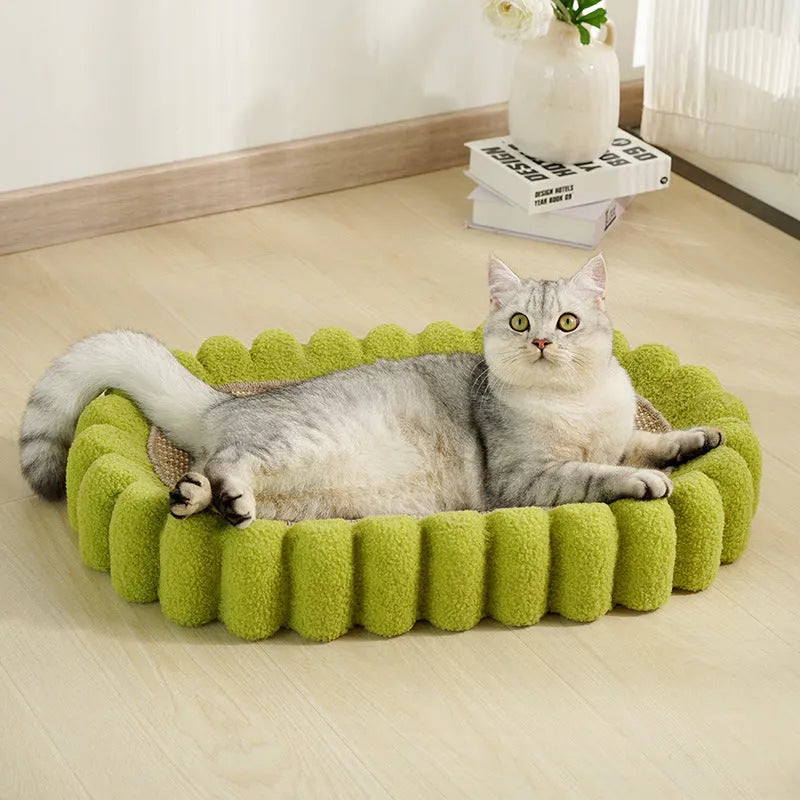 Green oval-shaped sisal cat scratching pad with a central bowl, serving as a cat bed and furniture protector.