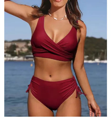 Women's solid colour cross-strap bikini in nylon fabric on a mannequin.