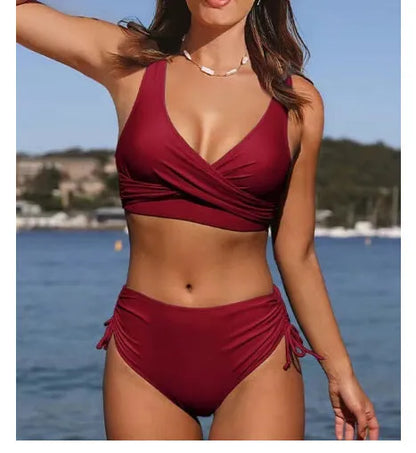 Women's solid colour cross-strap bikini in nylon fabric on a mannequin.