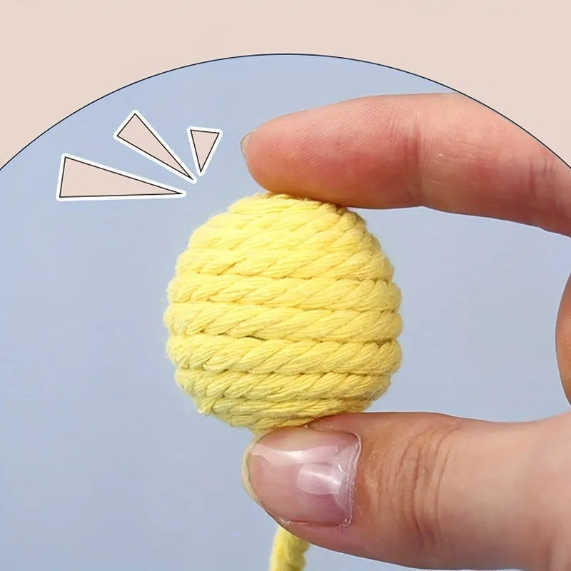 Interactive cat toy ball with bell and rope in green, pink, purple or yellow colours, shown in 3cm and 6cm sizes