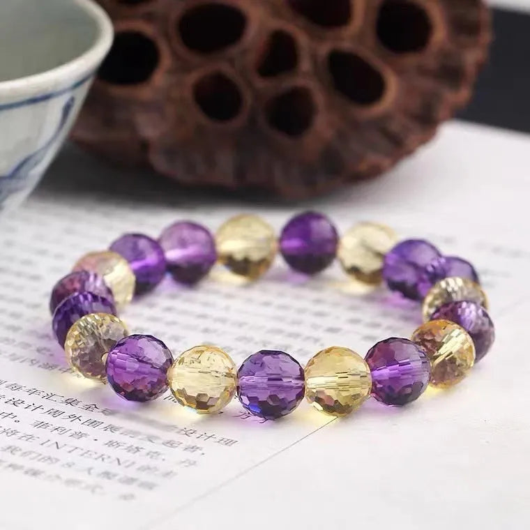 Handmade crystal bracelet with 128-cut gemstone beads and zodiac charm on wrist
