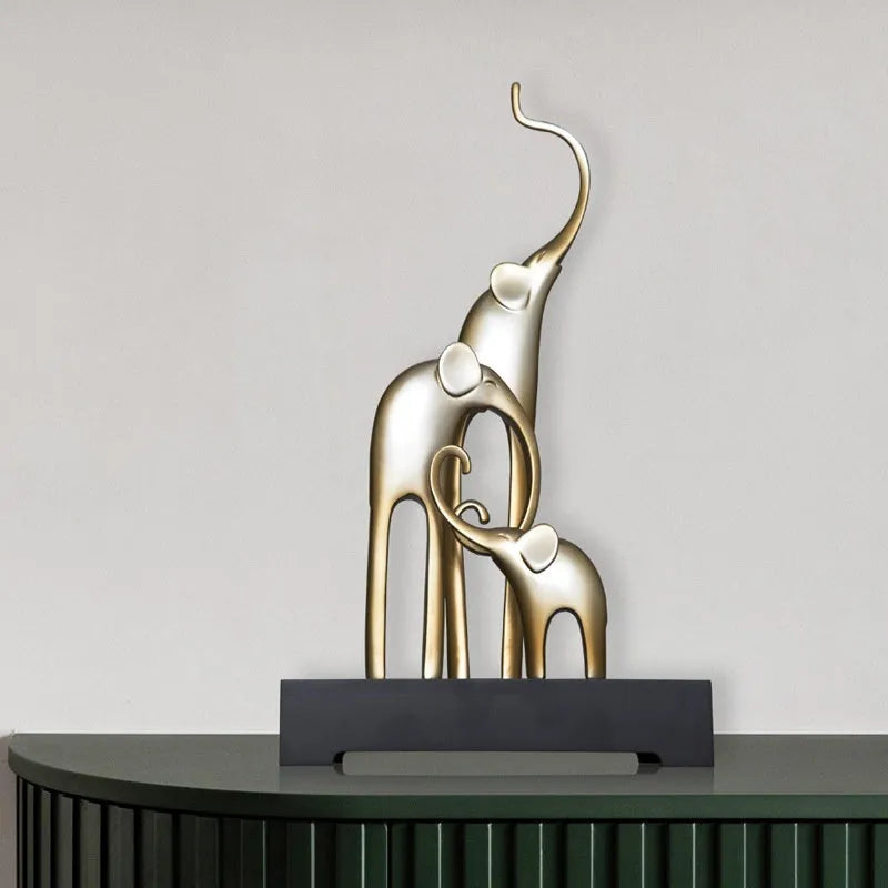 Fortune Bring Elephant resin decorative figurine in gold finish, 15cm tall on a wooden surface.