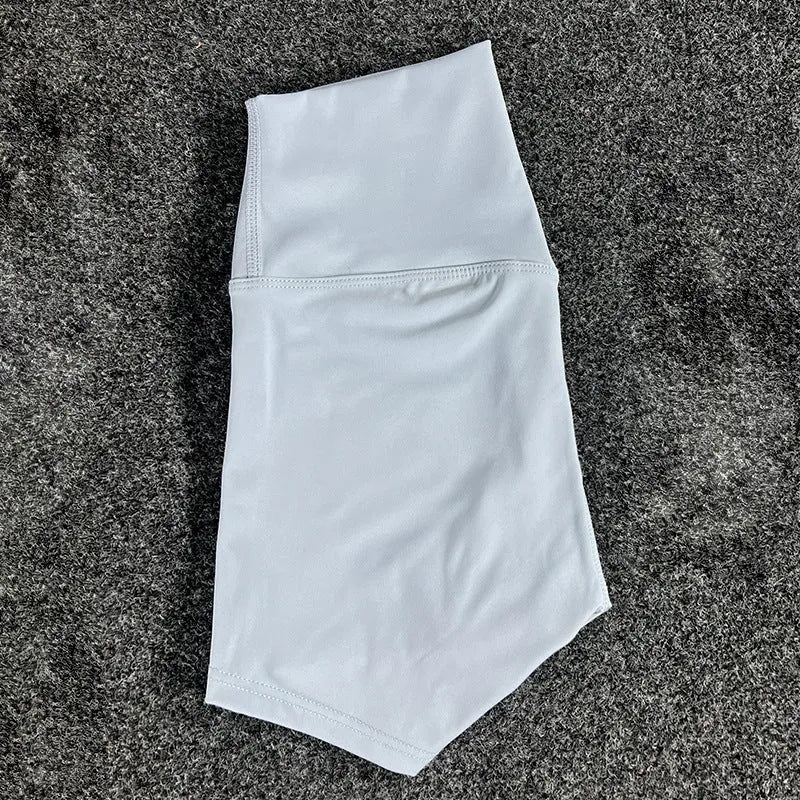 High-waisted yoga shorts in nylon fabric for moisture-wicking during sports, available in multiple colours and sizes.