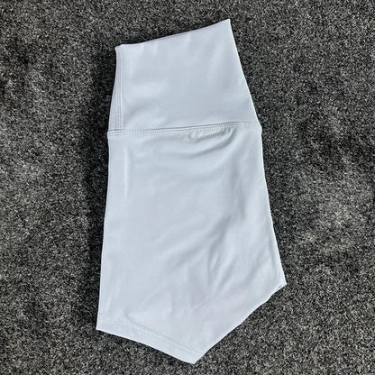 High-waisted yoga shorts in nylon fabric for moisture-wicking during sports, available in multiple colours and sizes.