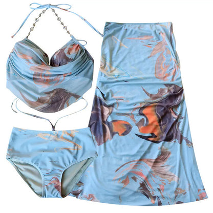 Women's blue print bikini set with triangle top, pants, and skirt, showing steel support structure.