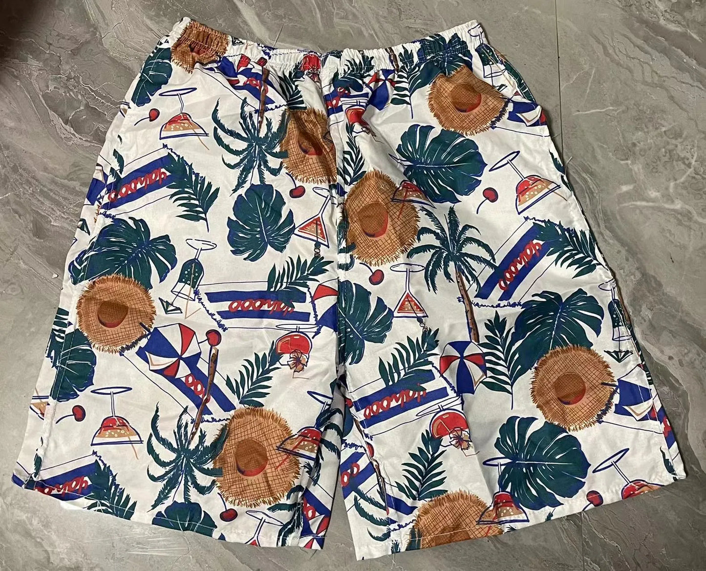 Men's floral printed swimming trunks in polyester fabric showing multiple pattern options for beach and pool use