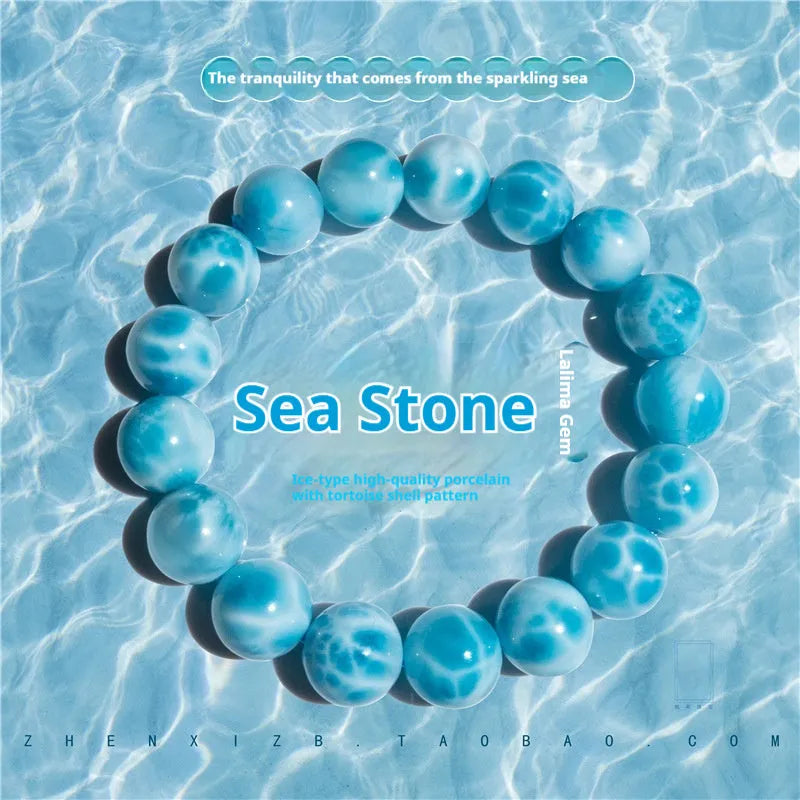 Blue bodhi bracelet with pearl accents showing bead sizes from 6mm to 14mm in Maillard style design