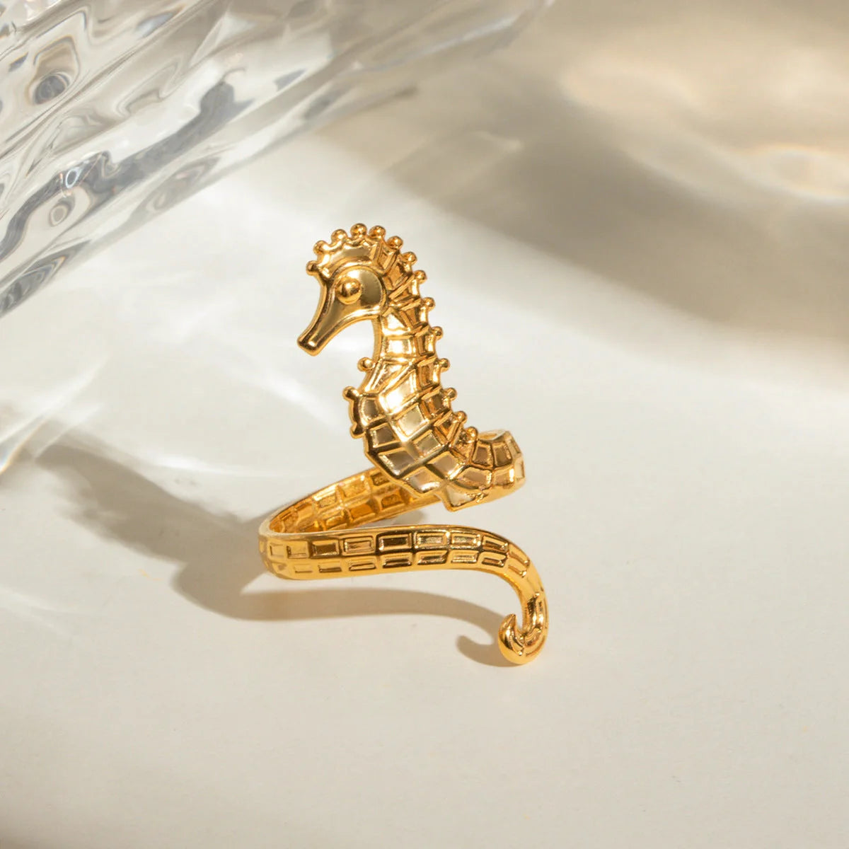 Shimmering 18K gold stainless steel cocktail ring with intricate seahorse design
