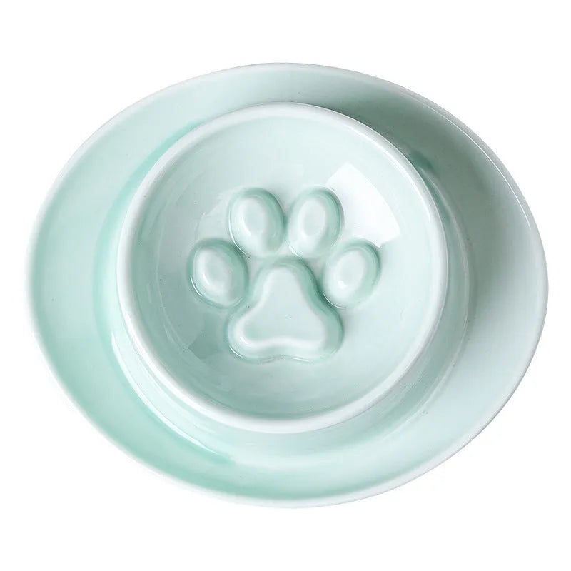 Green ceramic slow feeder bowl for pets with high walls and a non-slip rubber base.