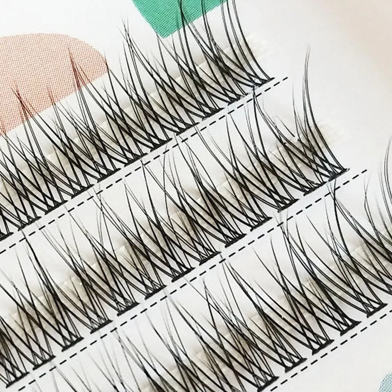 Black V-shaped fairy fishtail false eyelashes with thick segment design on a white background.