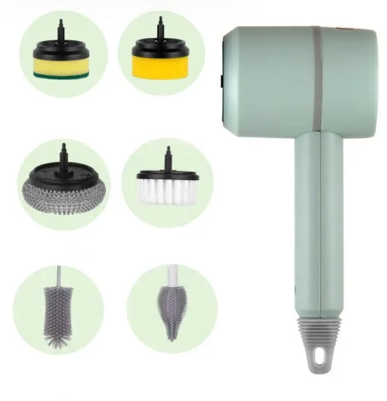 Green electric cleaning brush with scouring pad and brush heads on a kitchen worktop.