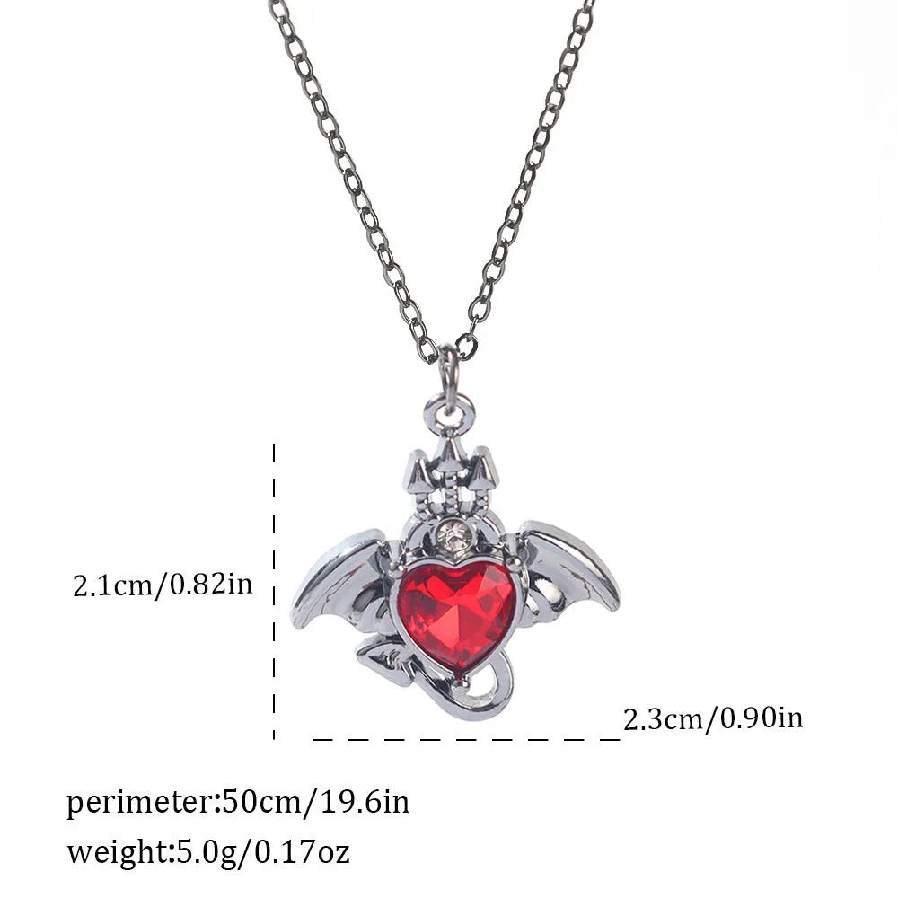 Gothic style zinc alloy necklace with bat pendant on a silver chain against dark background.