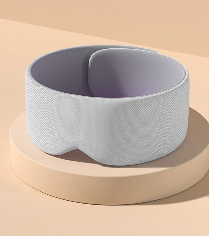 Gray double-sided sleep mask showing cool ice silk side and warm cotton side with adjustable magic tape closure