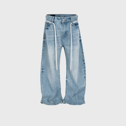 Blue vintage washed straight-leg denim trousers with a drawstring waistband on a hanger.