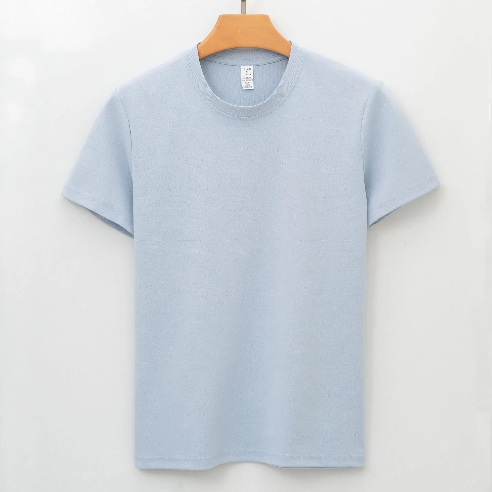 Men's solid colour antibacterial quick-dry short sleeve T-shirt on a hanger.