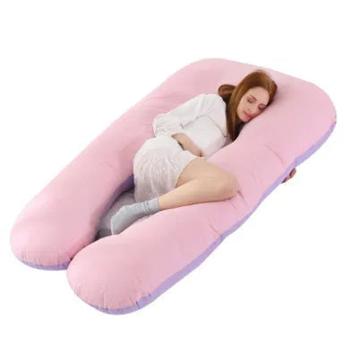 Large U-shaped pregnancy support pillow with removable cover and abdominal support belt.