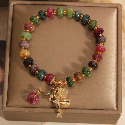 Colourful women's bracelet with butterfly charm, beads, and tourmaline accents on an alloy chain.