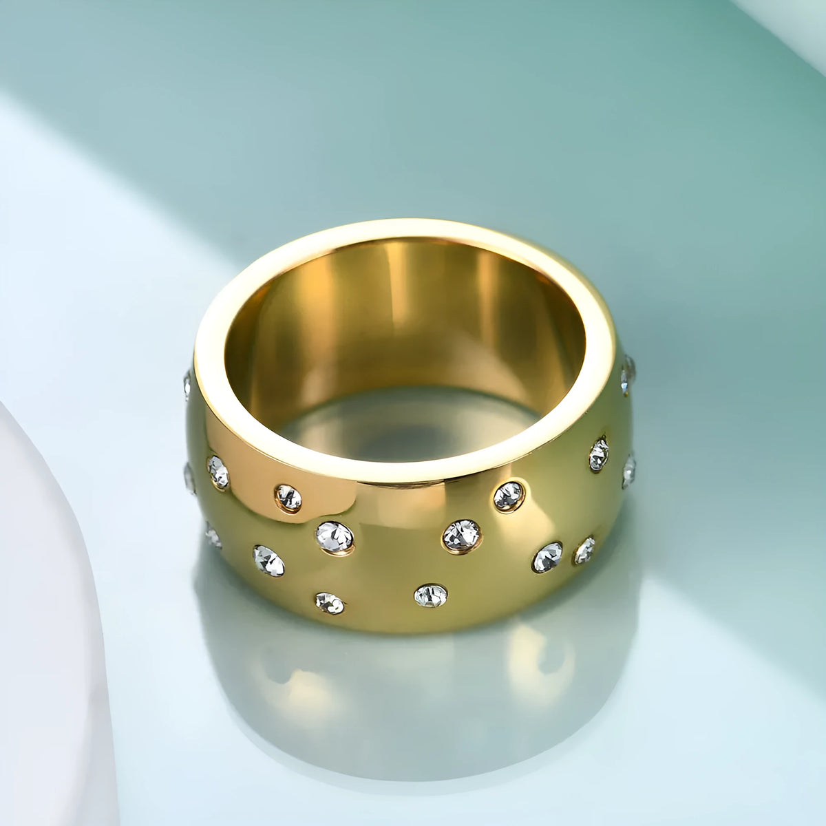 Geometric titanium steel women's couple ring with diamond treatment in black, gold, rose gold, and steel colours.