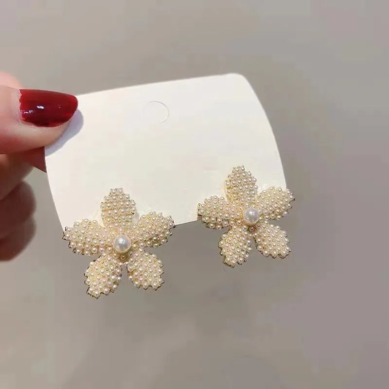 Korean-style women's pineapple starfish pearl alloy earrings with gemstone details in gold, pearl flower, silver, and starfish pearl colours.
