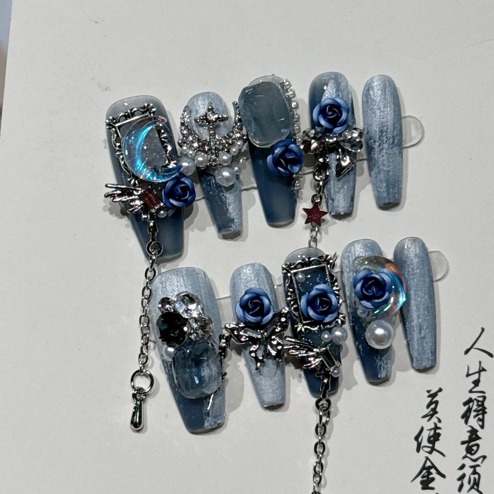 Heavy industry night blue plastic nail armour suit with ornate rose and tulip pattern, shown in size L.
