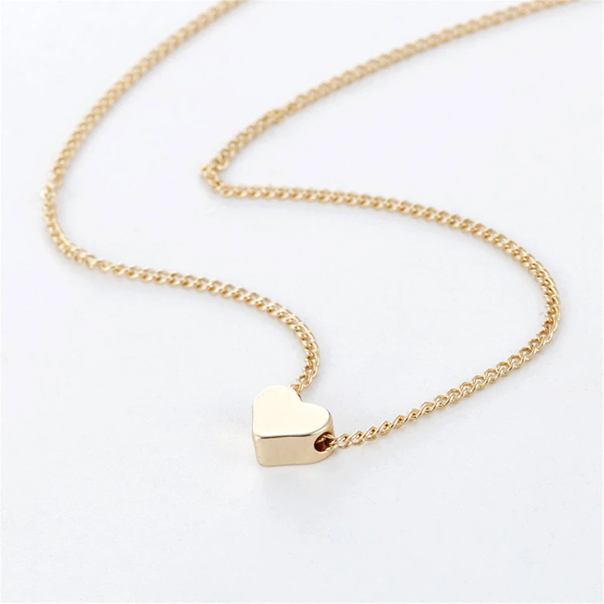 Elegant clavicle necklace with a double-sided love pendant, made of high-quality alloy for a timeless, fashion-forward look.