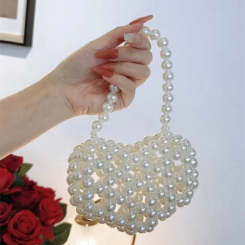 Women's imitation pearl mini crossbody handbag with geometric pattern in a pearl colour.