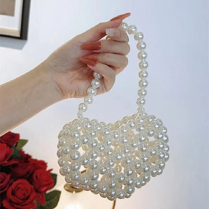 Women's imitation pearl mini crossbody handbag with geometric pattern in a pearl colour.