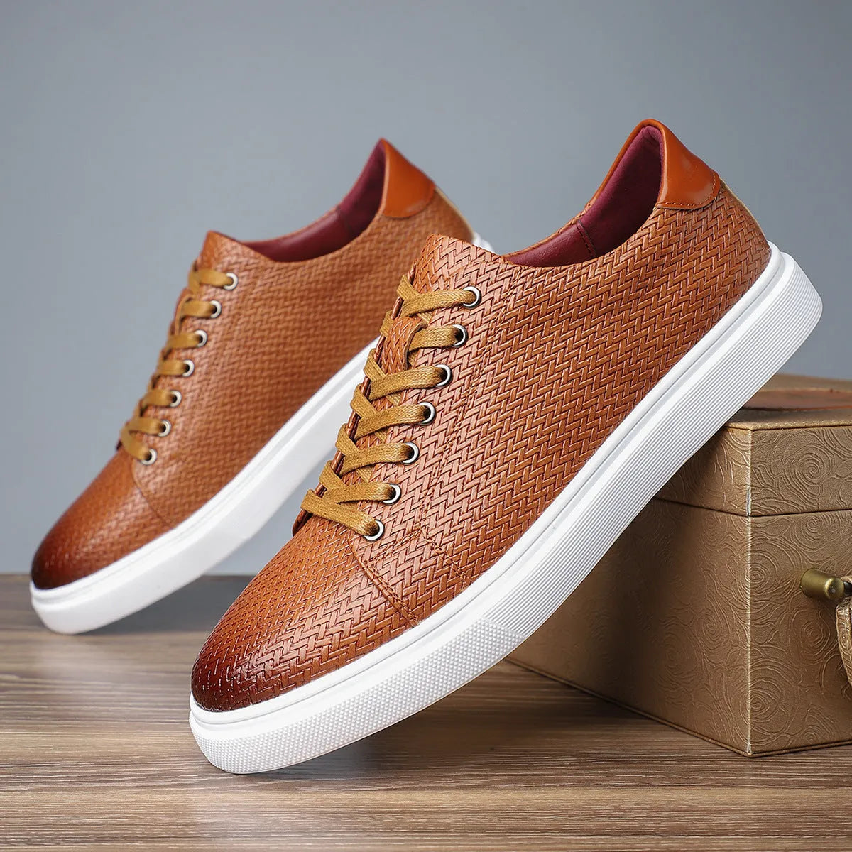 Men's black low-top business shoe with artificial PU leather upper and rubber sole.