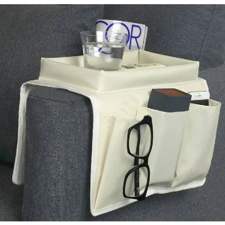 Sofa arm organizer bag in black with multiple pockets for remote controls and magazines