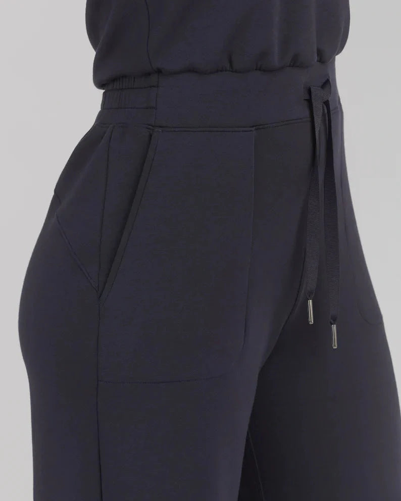 Women's lace-up jumpsuit pants in polyester, available in multiple colors and sizes for adjustable fit.