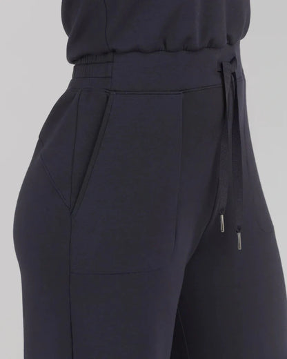 Women's lace-up jumpsuit pants in polyester, available in multiple colors and sizes for adjustable fit.