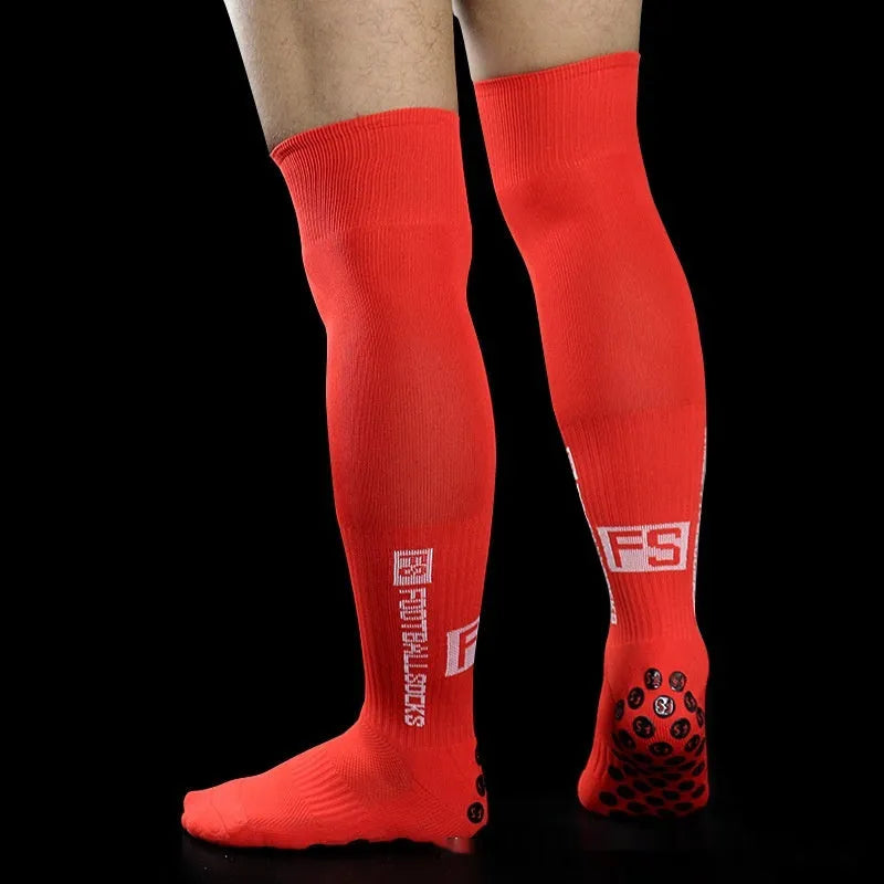 Anti-slip dispensing knee-length football socks in polyester, available in ten colours including black, white, red, and blue.