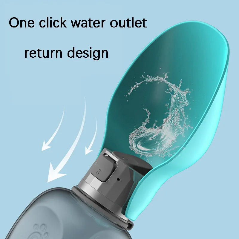 Blue grey portable dog water bottle with foldable drinking bowl and wrist strap, shown next to a dog.