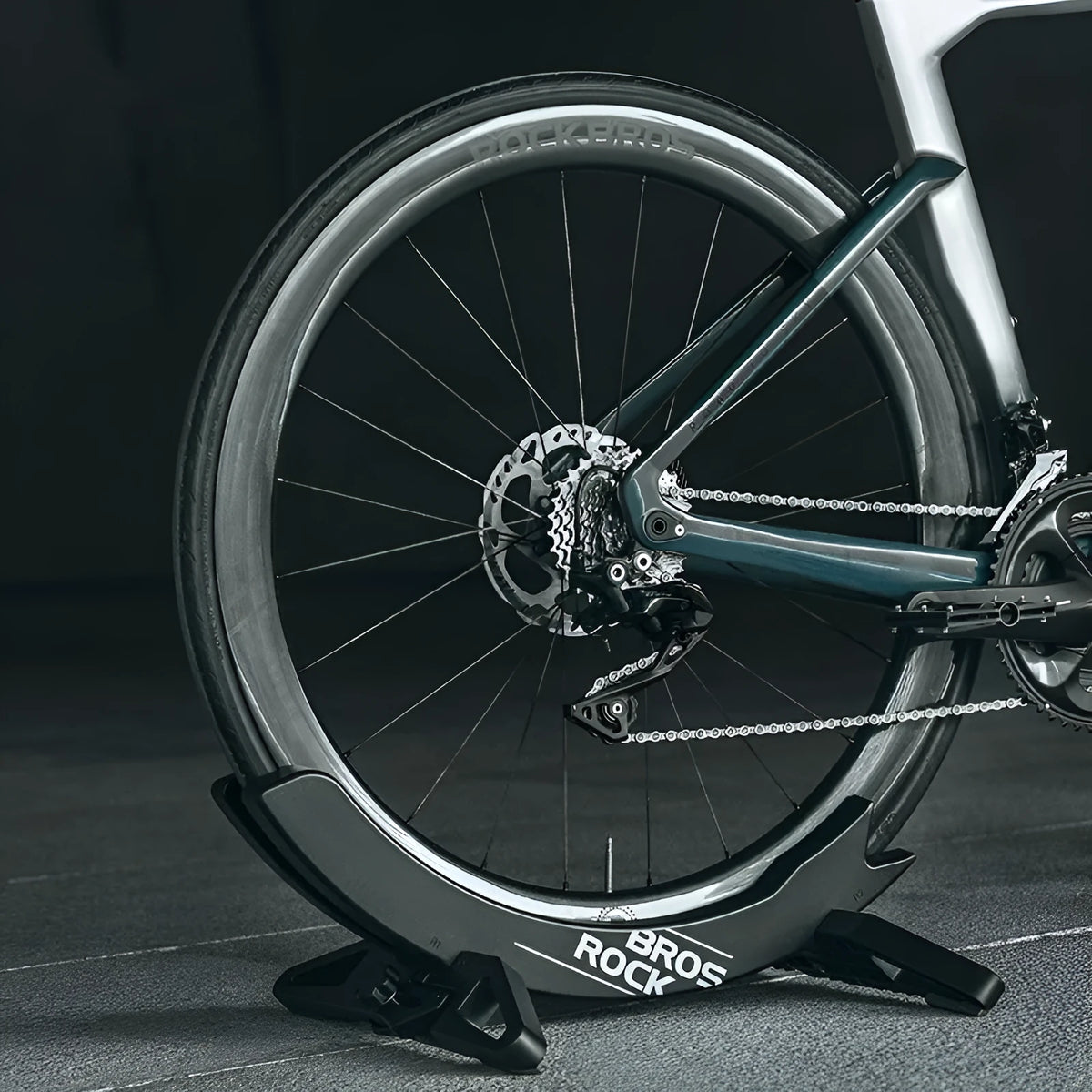 Black ABS plastic wall-mounted bicycle parking rack holder for road and mountain bikes.
