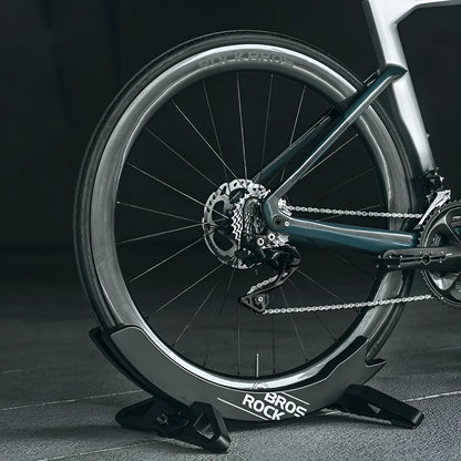 Black ABS plastic wall-mounted bicycle parking rack holder for road and mountain bikes.