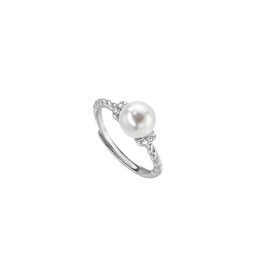Adjustable copper ring with pearl inlay in geometric twist design, gold or silver finish