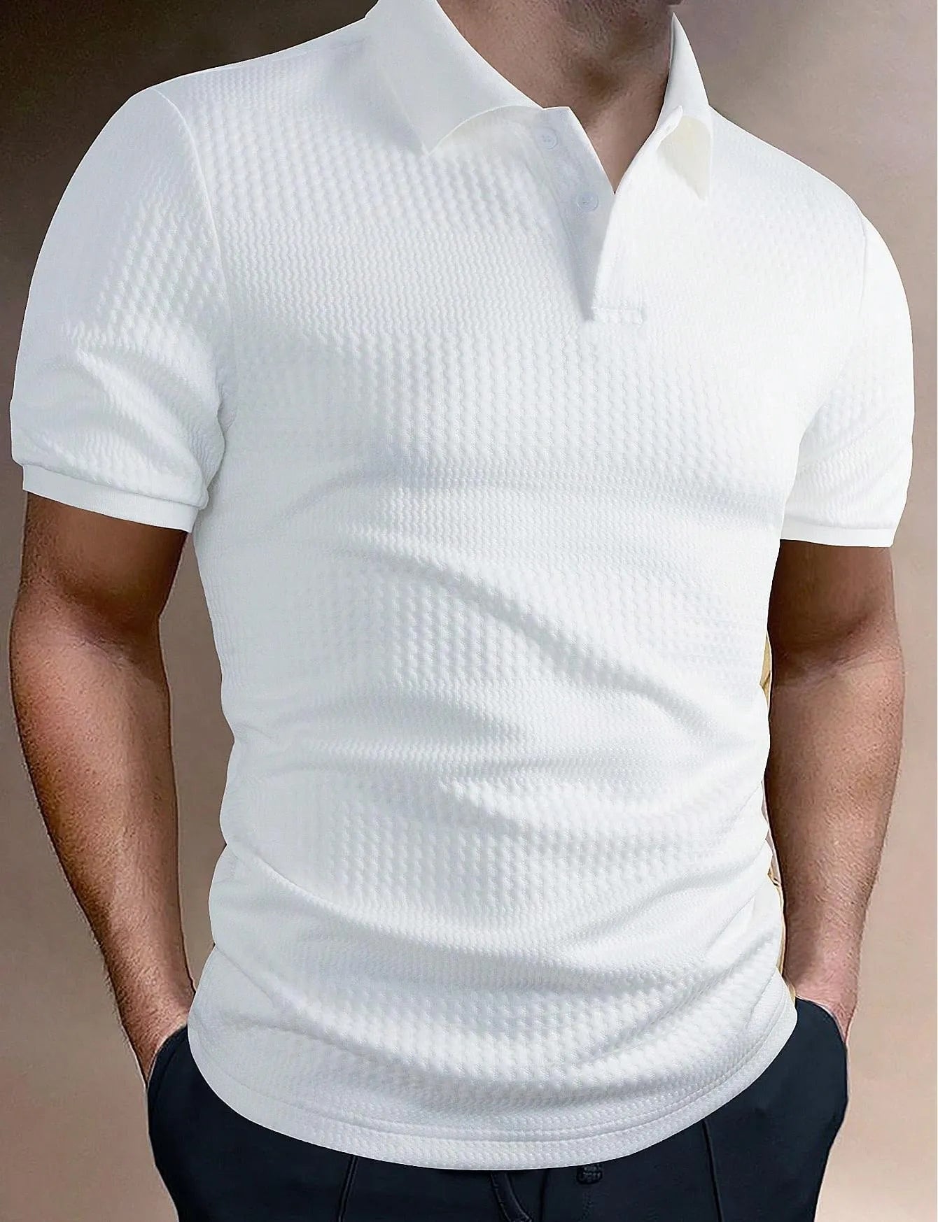 Man wearing a striped loose-fit polo shirt in light blue, showing short sleeves and asymmetric detail.