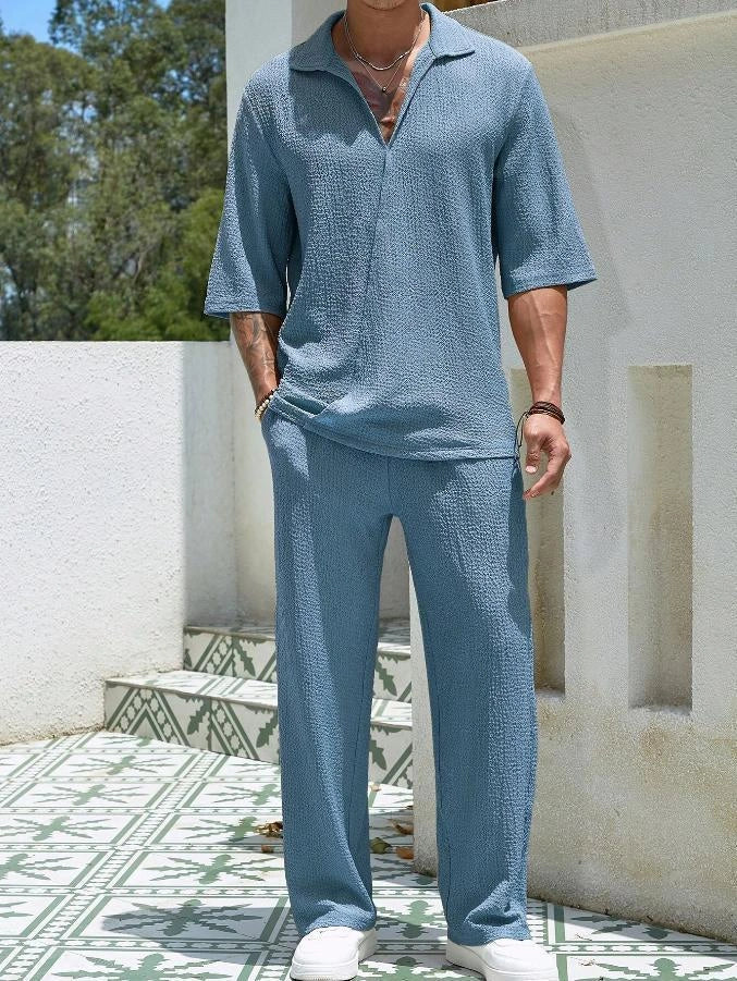Men's summer commuter set in cotton, featuring a short-sleeve top and loose trousers, available in four colors.