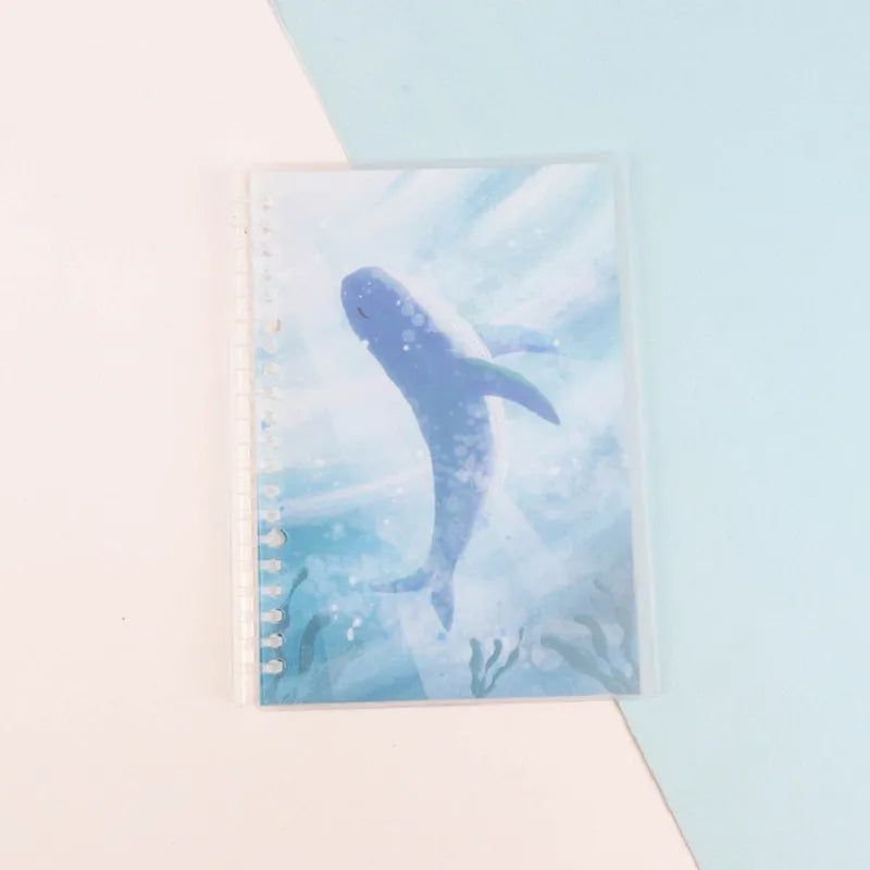 Hard cover A5 and B5 notebook with animal painting designs like whales and fruit, showing coil binding.
