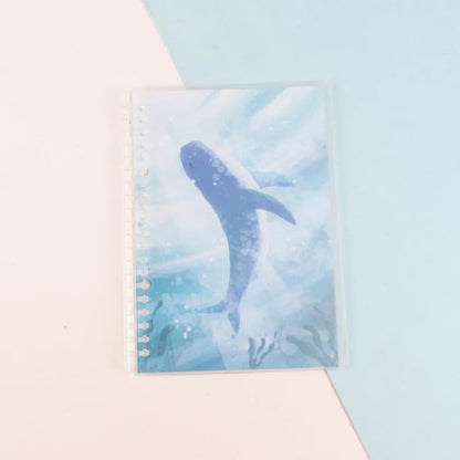 Hard cover A5 and B5 notebook with animal painting designs like whales and fruit, showing coil binding.