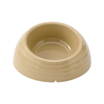 Single stainless steel cat bowl with a light green plastic base on a floor.