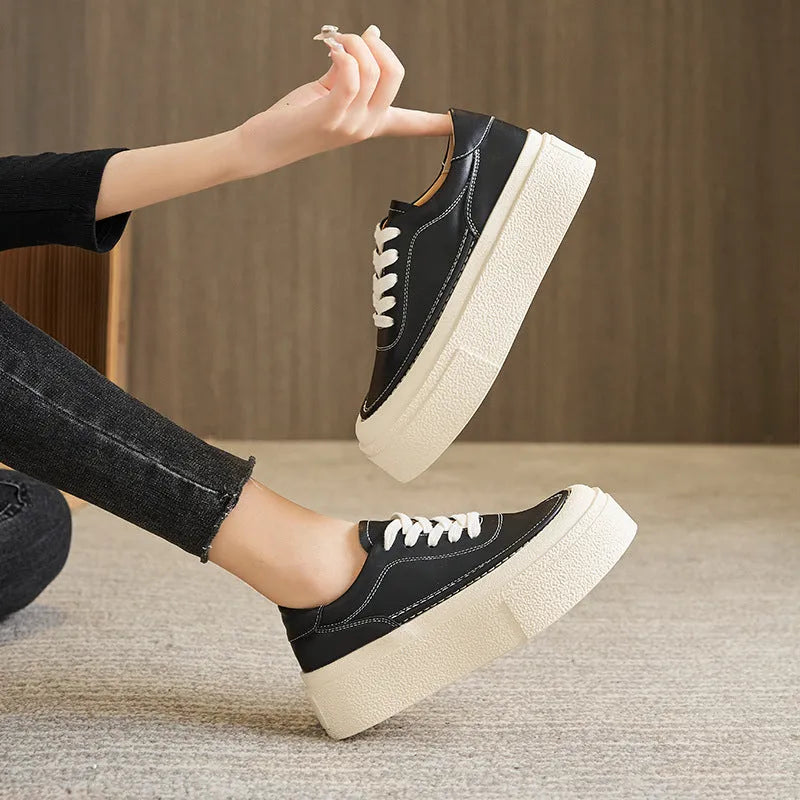Women's platform casual sports board shoes in black or white cowhide with embossed leather and round toe design, rubber sole construction, full UK size range 34 to 40