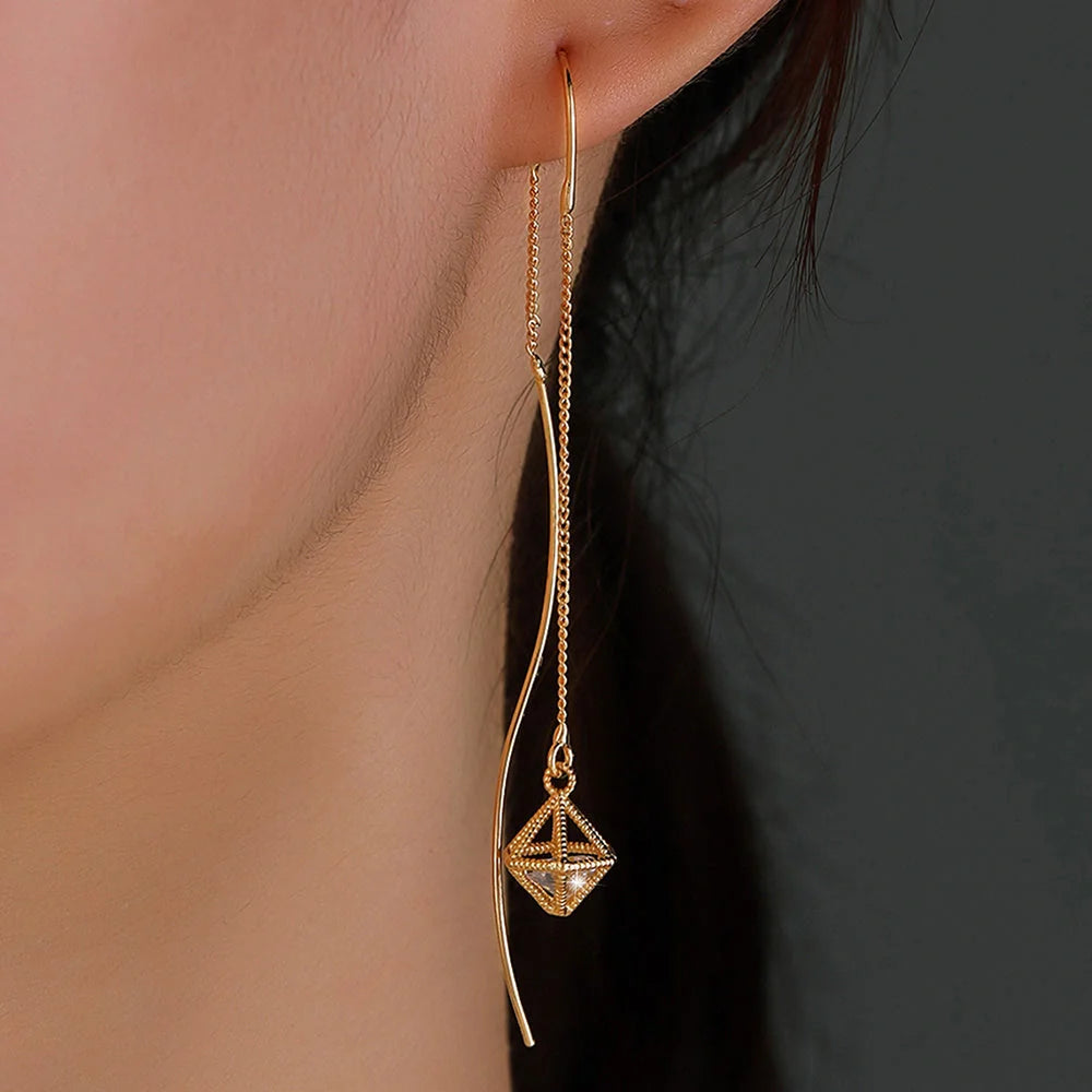 Gold Bronze Cutout Zircon Tassel Earrings with sparkling stones and intricate design