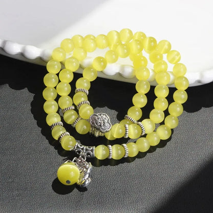 Women's opal crystal bracelet with lucky cat charm and geometric design, shown in blue colour option