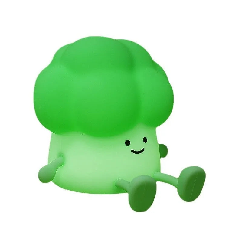 Cartoon eggplant shaped night lamp emitting soft yellow light, showing compact dimensions