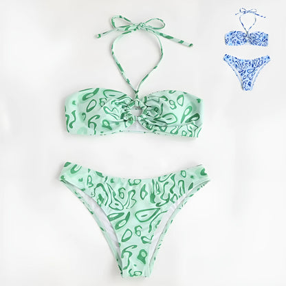 Blue floral pattern bandeau bikini swimsuit with backless design on mannequin