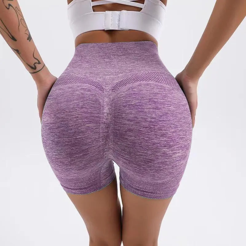Women's high-waisted black seamless yoga shorts for fitness and running.