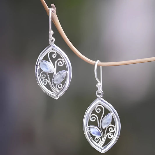 Silver leaf-shaped earrings with a central colourful moonstone on a white background.