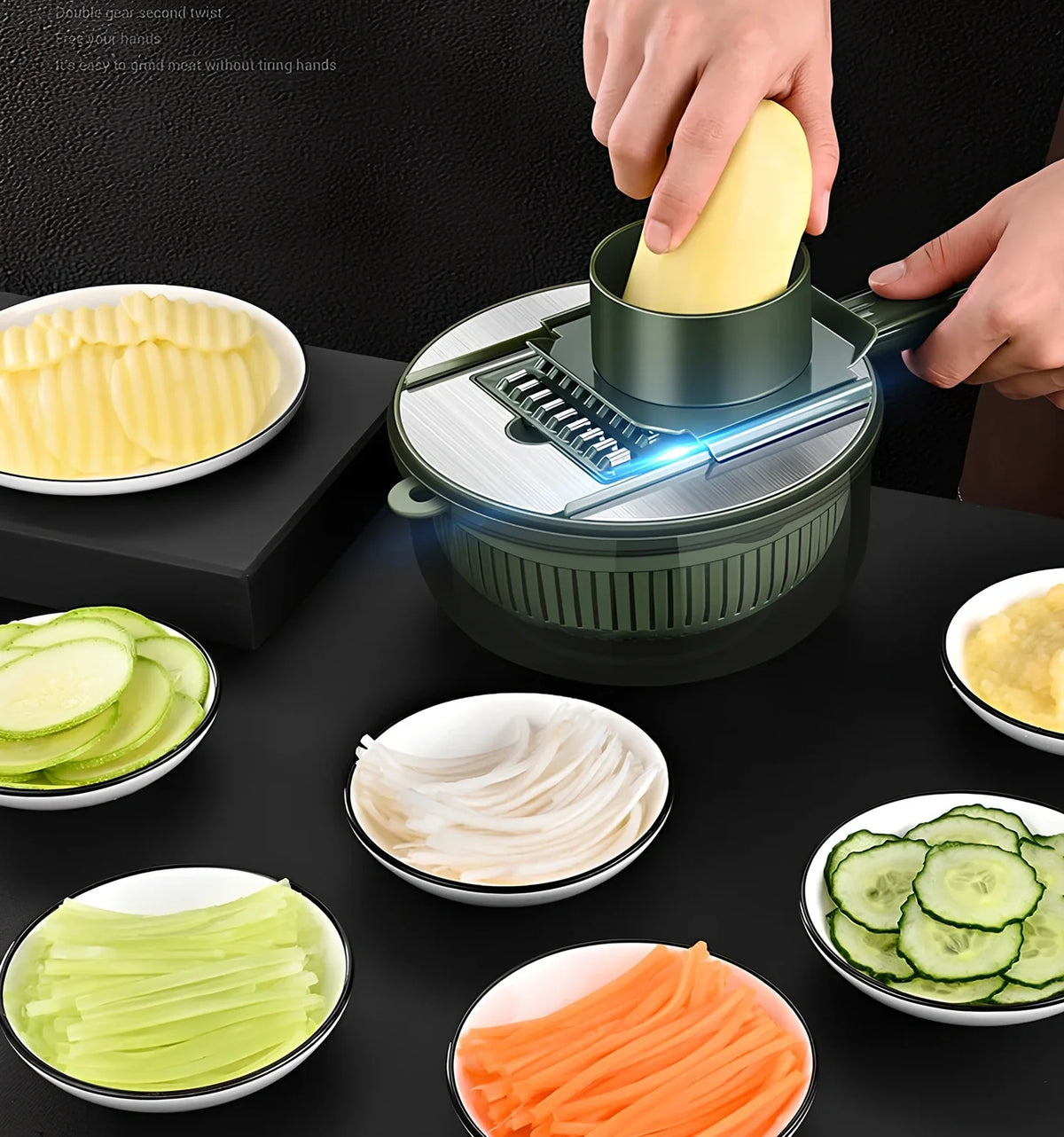 Grey and green vegetable slicer with five stainless steel blades and protective gauntlet